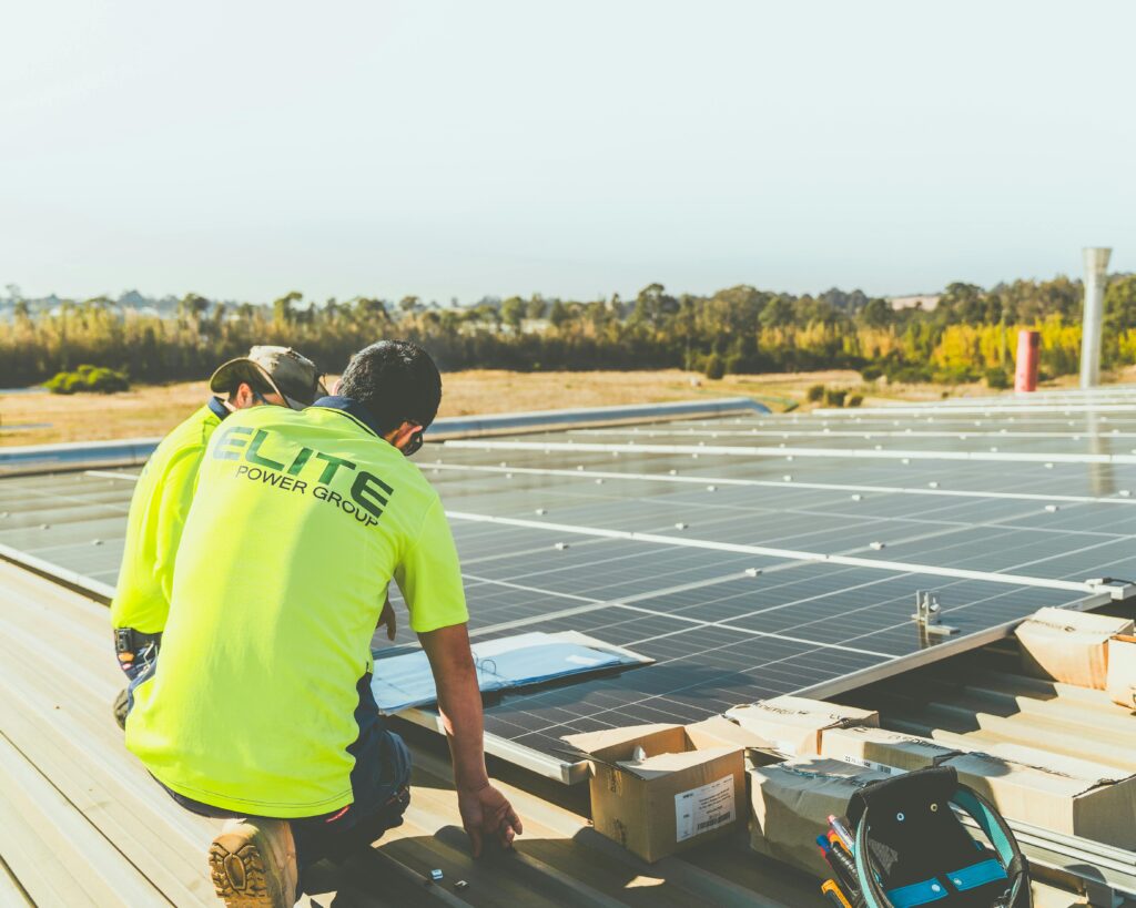 Electricians installing a solar power system.