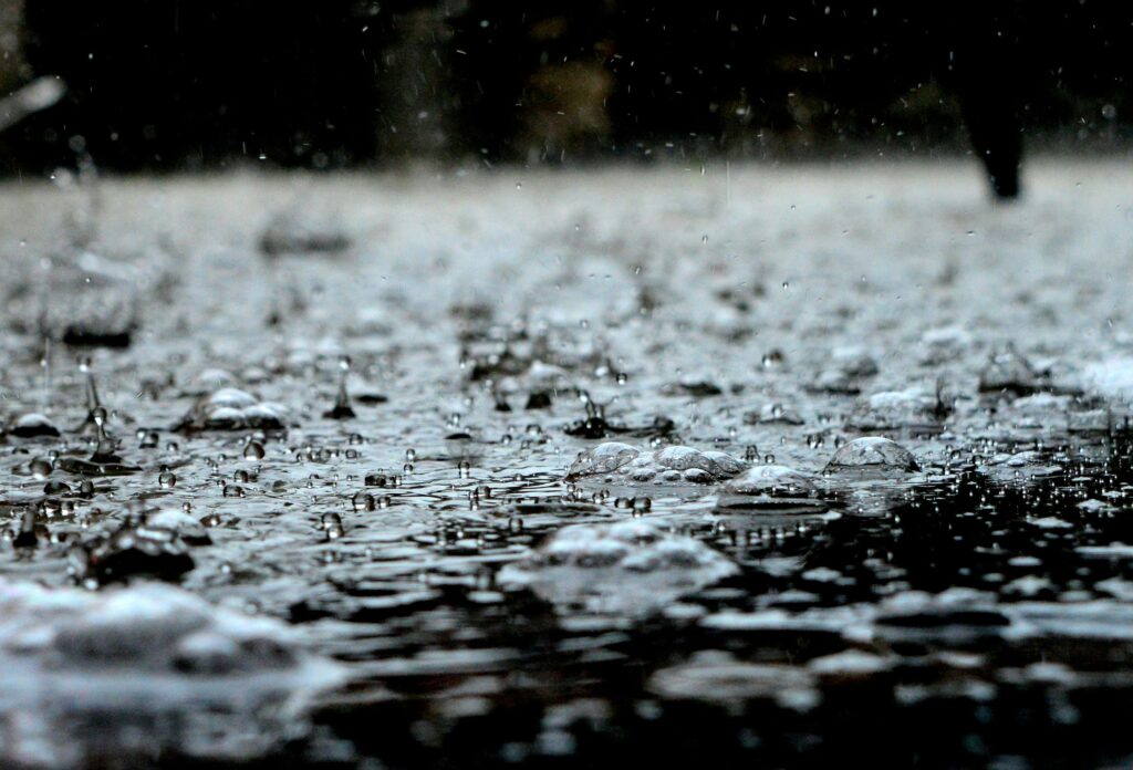 rain water collecting on a flat surface, like a roof